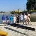 Tonino Bernabè con gli amministratori dei tre Comuni e il personale del Canoa Club Rimini al punto canoa della diga del Conca